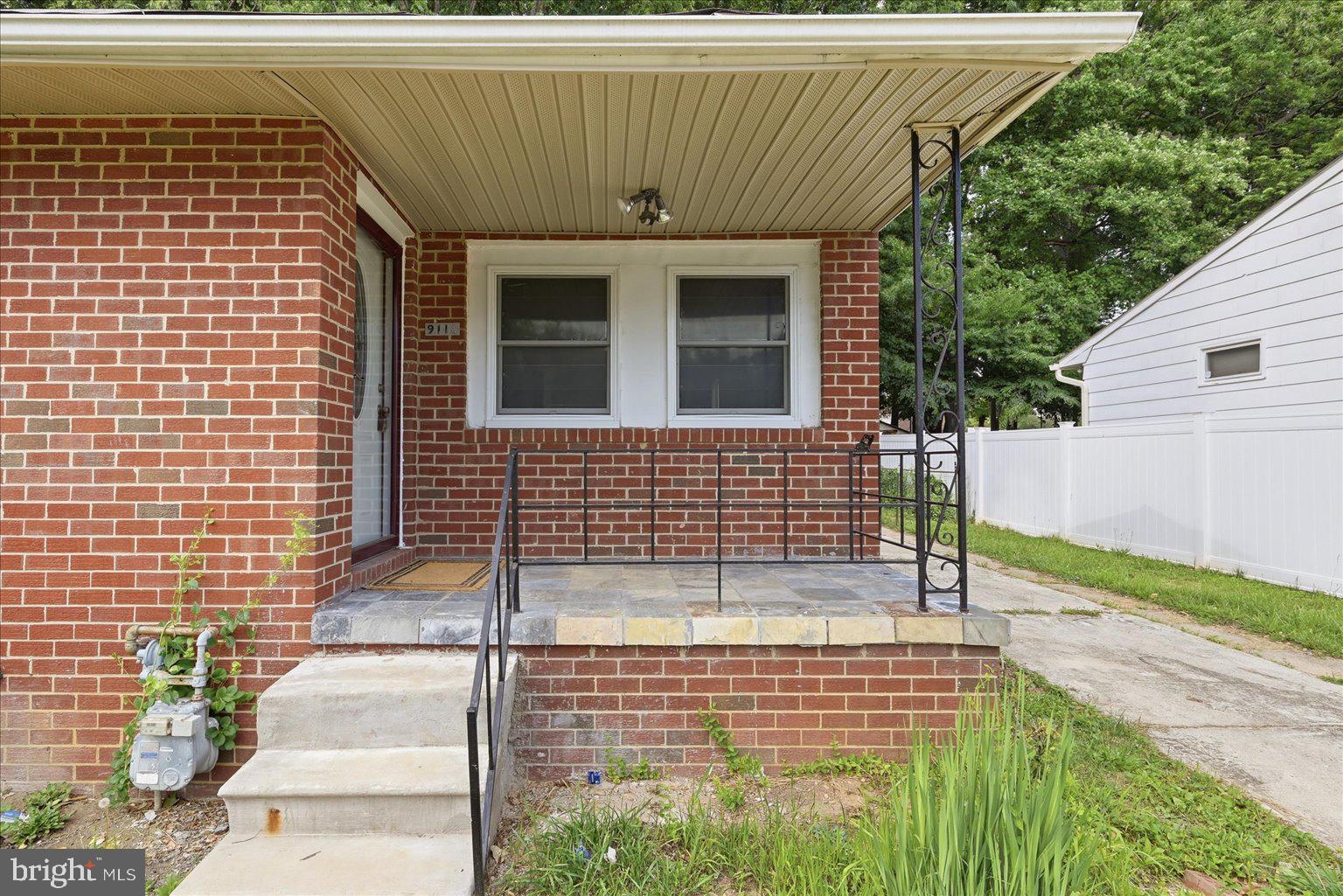 9110 Meadow Heights Road Randallstown, MD 21133 - Photo 4 of 39 Charming brick entryway with greenery.