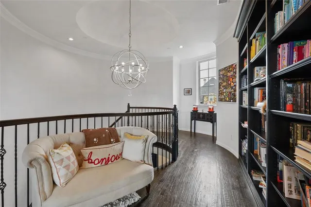a bed room with furniture and a book shelf