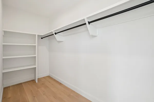 a view of an empty walk in closet