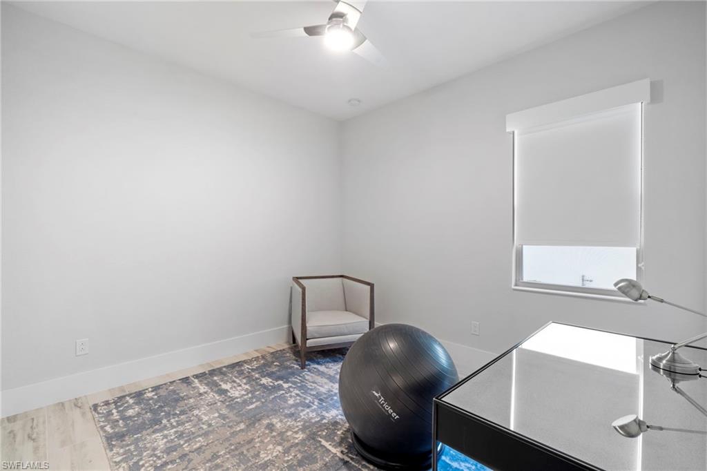 6136 Rodney Bay Lane Naples, FL 34113 - Photo 13 of 29 a room with table and chair