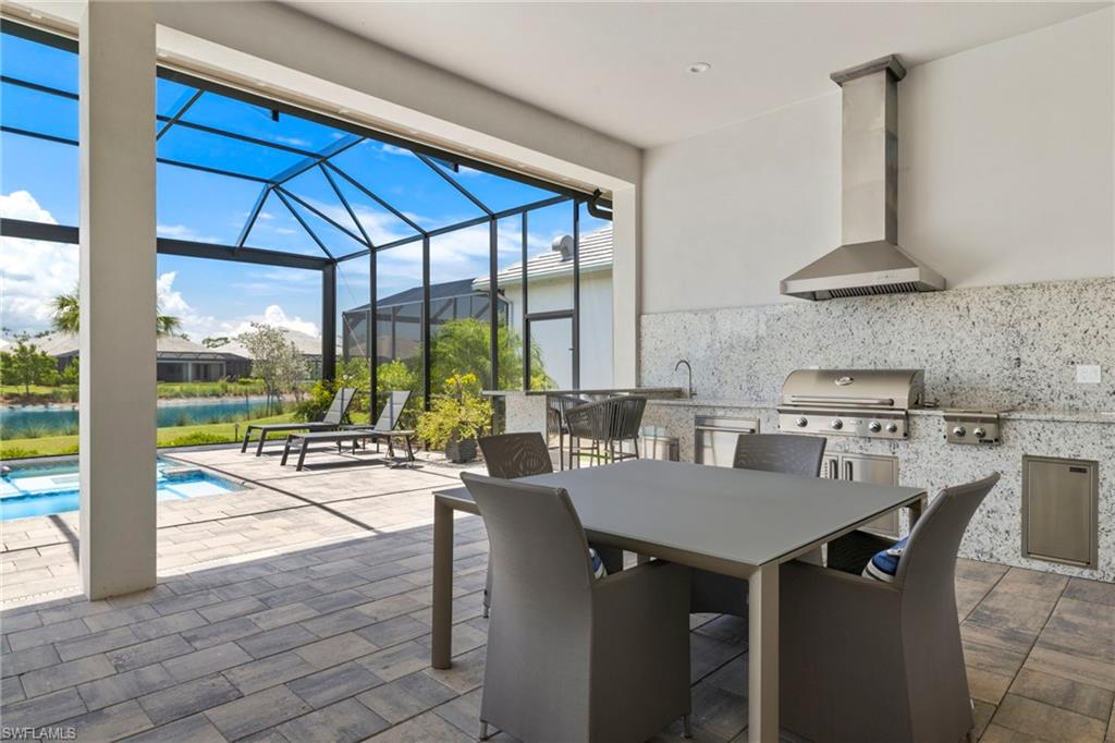 6136 Rodney Bay Lane Naples, FL 34113 - Photo 26 of 29 a view of a dining room with furniture window and outside view