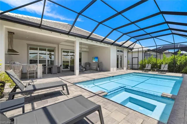 a view of a backyard with sitting area