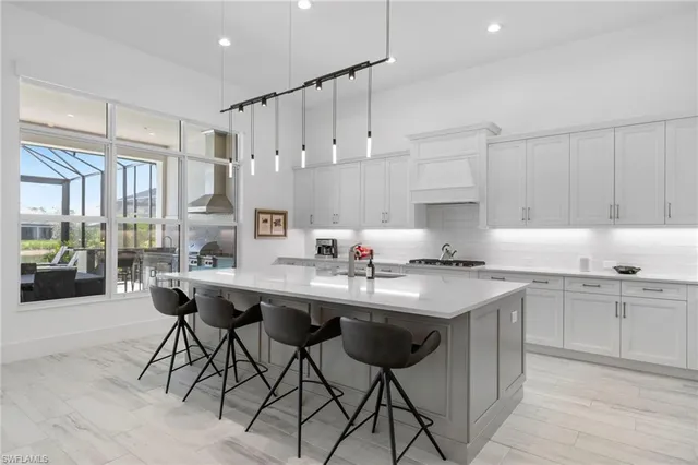 a kitchen with a sink and cabinets