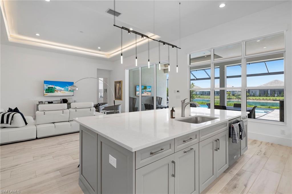 6136 Rodney Bay Lane Naples, FL 34113 - Photo 8 of 29 a very nice looking living room with a large window