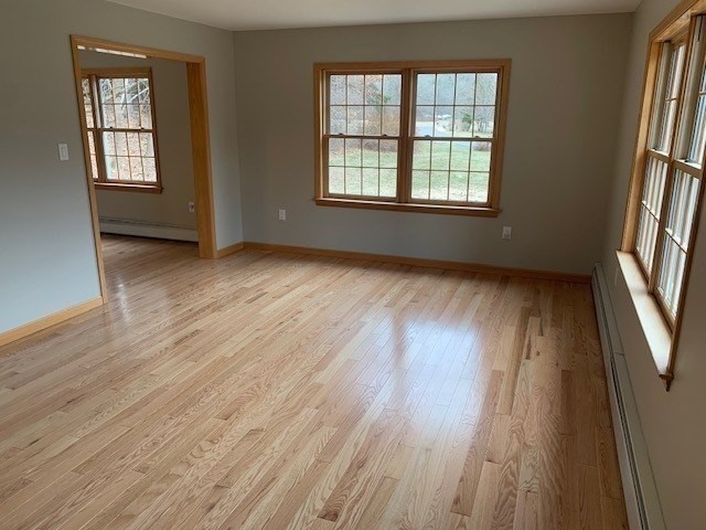 59 Strowbridge Road Northfield, MA 01360 - Photo 12 of 26 an empty room with wooden floor and windows
