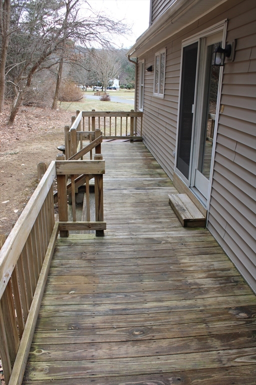 59 Strowbridge Road Northfield, MA 01360 - Photo 6 of 26 a view of a balcony with wooden floor and seating space