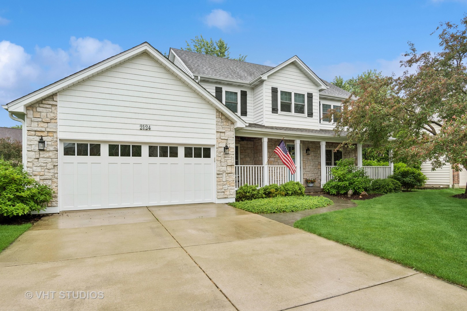 a view of house with yard and green space