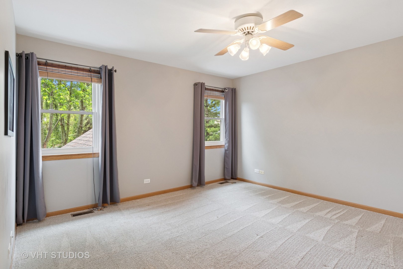 2124 Wicklow Road Naperville, IL 60564 - Photo 20 of 35 an empty room with windows and fan