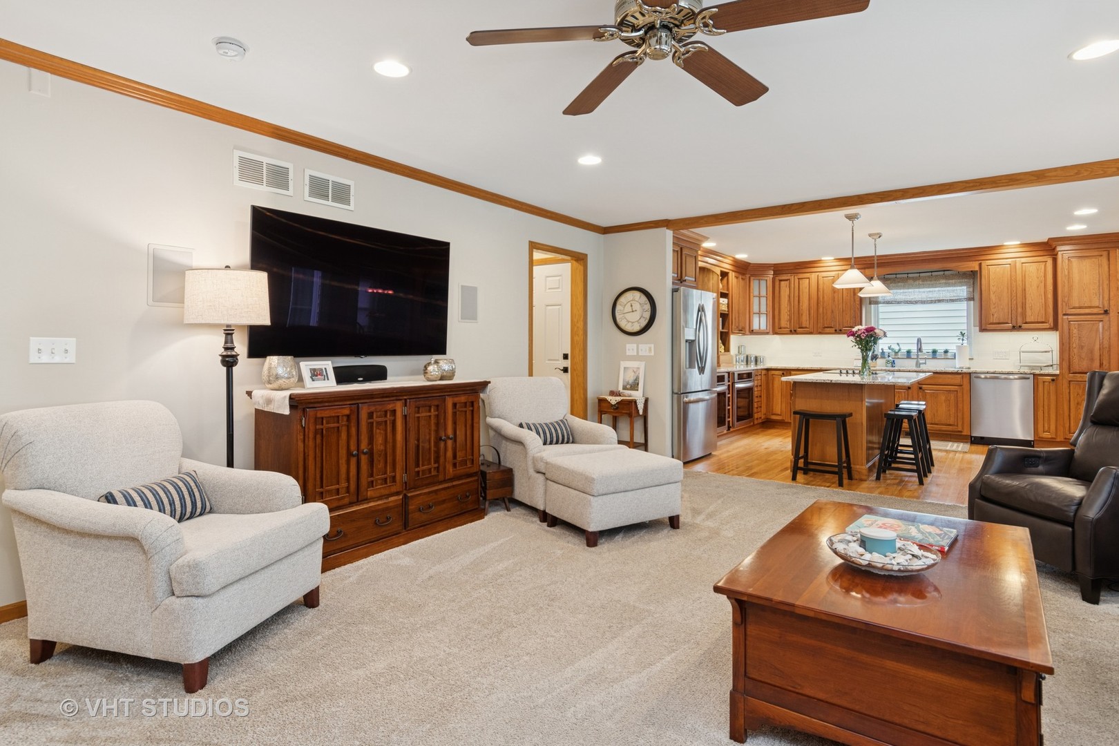 2124 Wicklow Road Naperville, IL 60564 - Photo 9 of 35 a living room with furniture and a flat screen tv