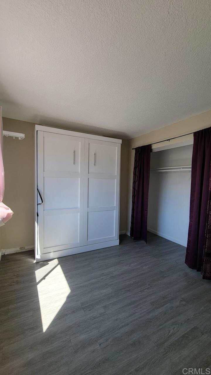 742 A Street, Unit 15 Ramona, CA 92065 - Photo 11 of 18 an empty room with wooden floor and closet