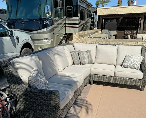 a view of a couches and dinning table in patio