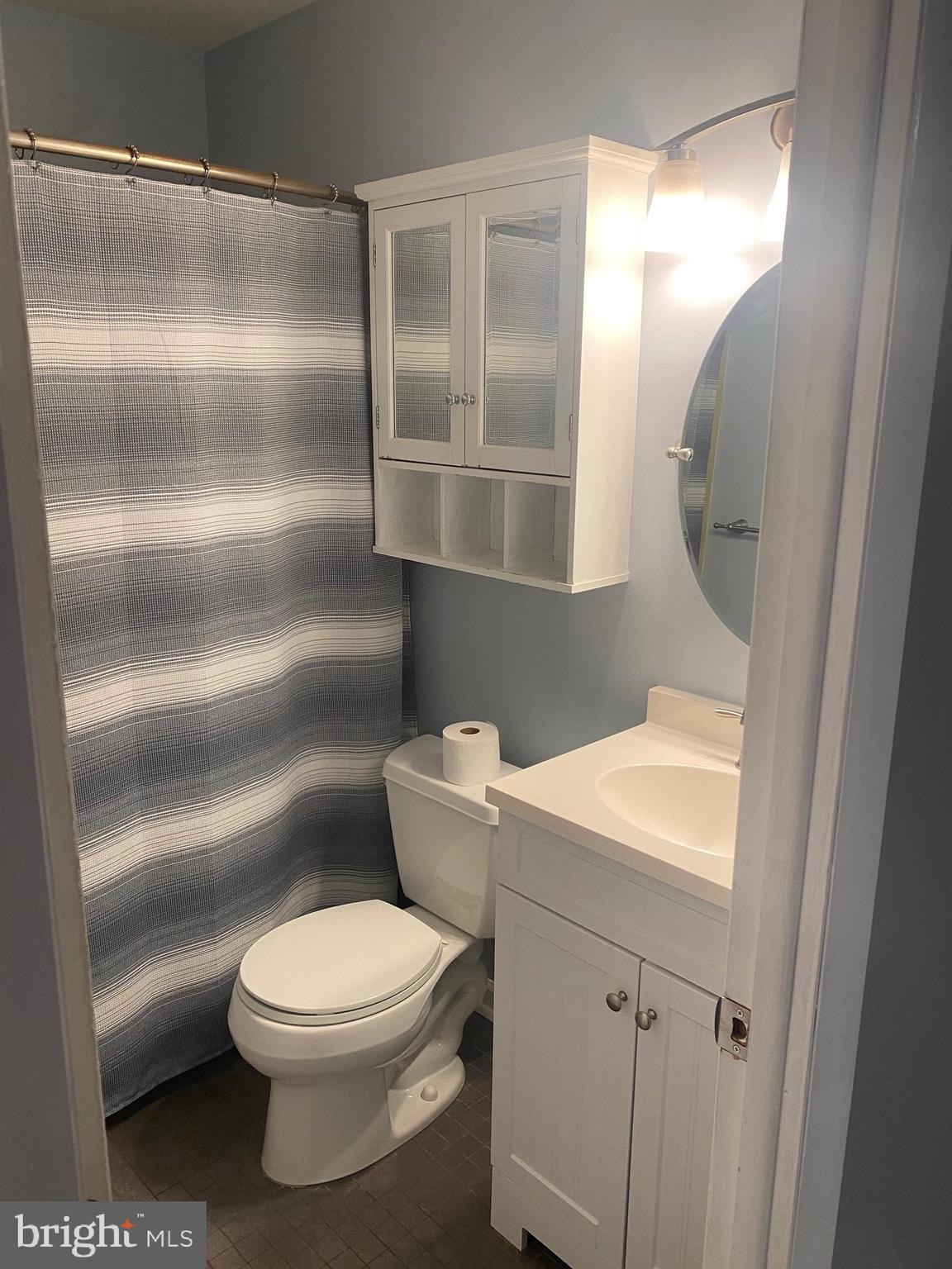 300 Winding Way, Unit B16 Downingtown, PA 19335 - Photo 15 of 21 a white toilet sitting next to a bathroom sink