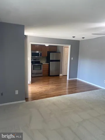 a view of livingroom with kitchen