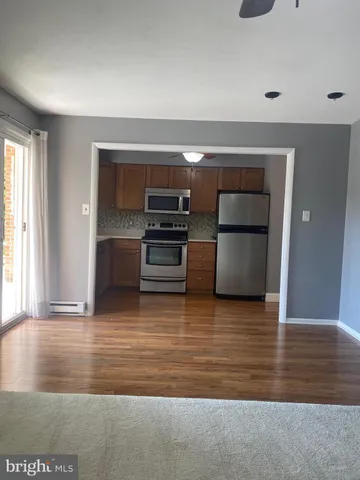 a view of kitchen and wooden floor