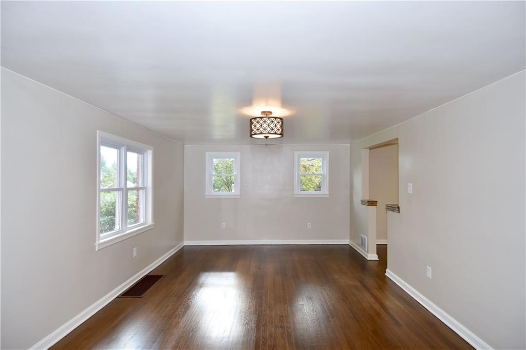 1195 Harvey Run Road Freedom, PA 15042 - Photo 4 of 19 Living Room: Notice the stunning hardwood floors, fresh paint, and new lighting fixtures