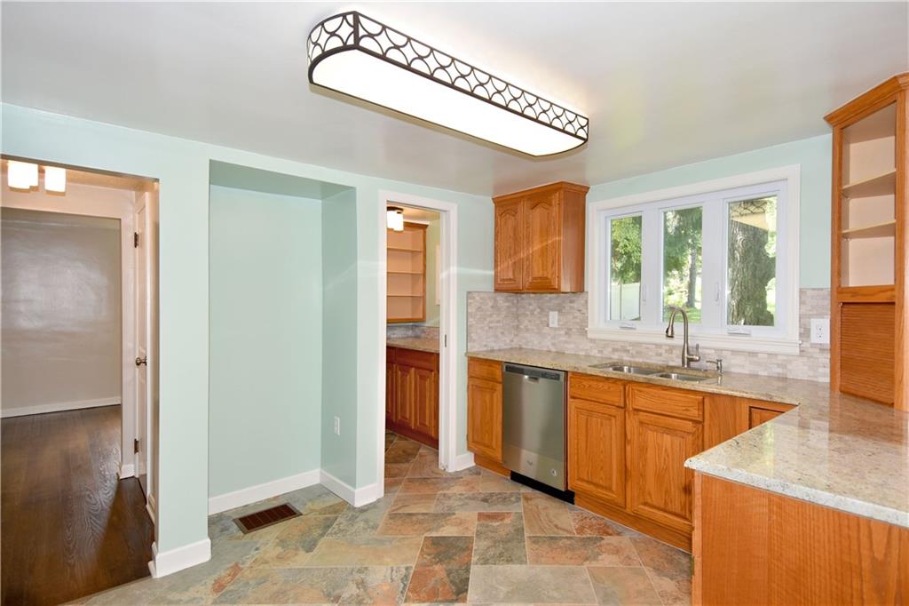 1195 Harvey Run Road Freedom, PA 15042 - Photo 9 of 19 Updated Kitchen with new lighting fixture, fresh paint, and a pantry