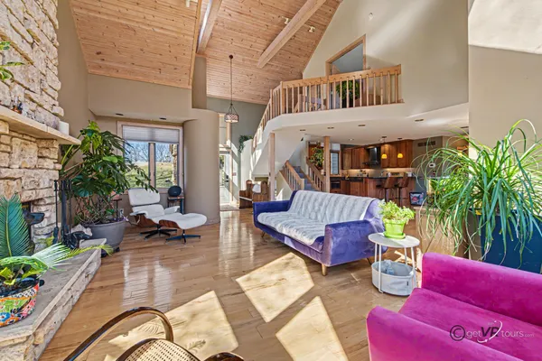 a kitchen with stainless steel appliances granite countertop a refrigerator a stove top oven a sink dishwasher and wooden cabinets