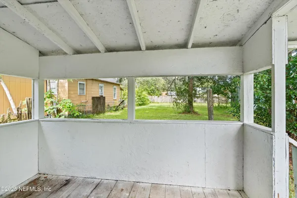 a view of hallway with wooden floor
