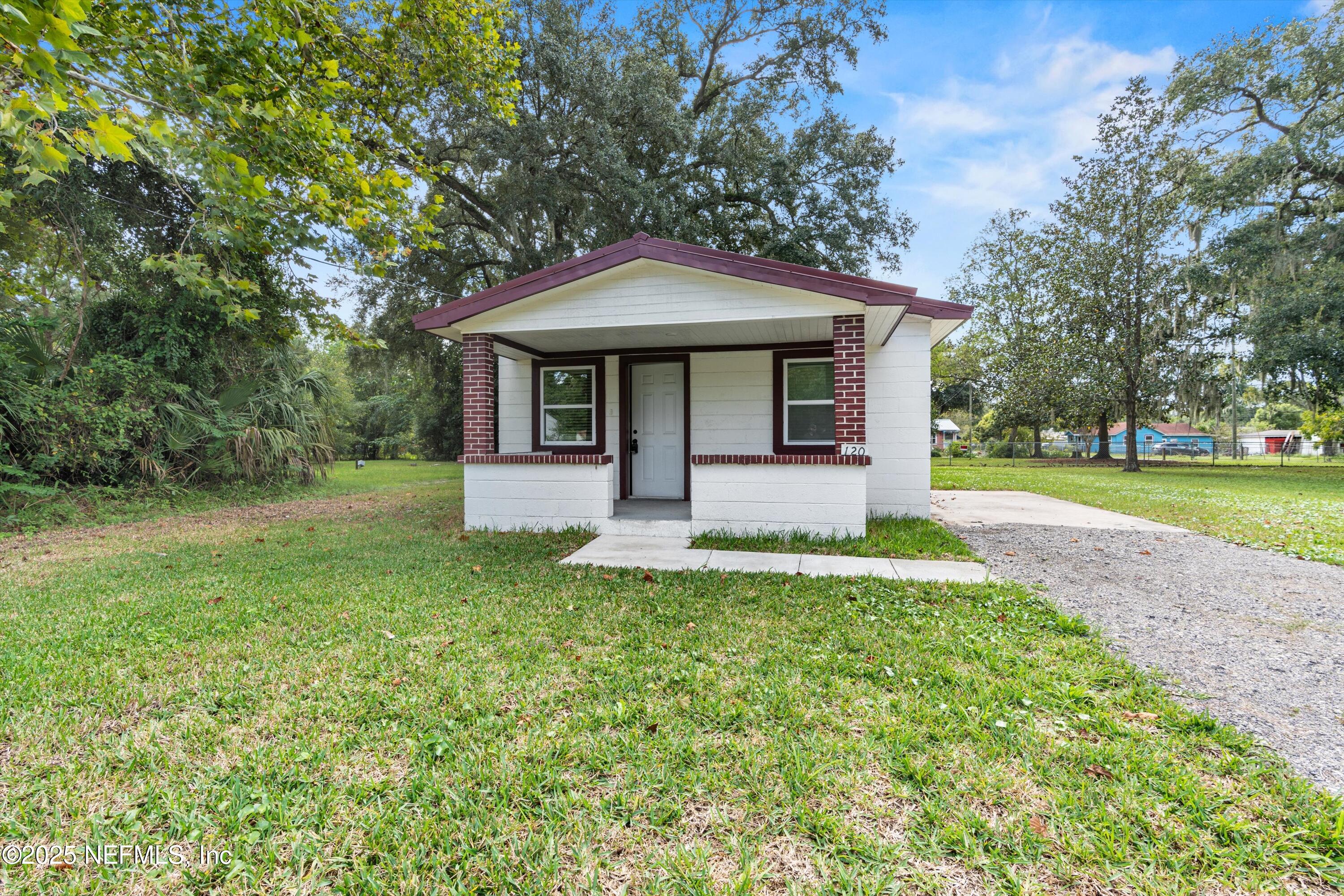 123 Mccallman Road Jacksonville, FL 32218 - Photo 20 of 62 a front view of a house with garden