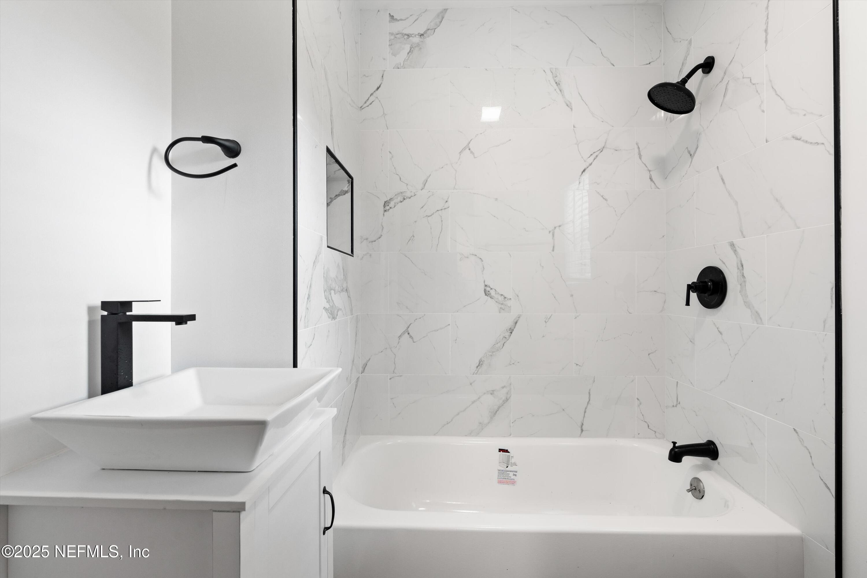 123 Mccallman Road Jacksonville, FL 32218 - Photo 23 of 62 a bathroom with a bathtub and a shower