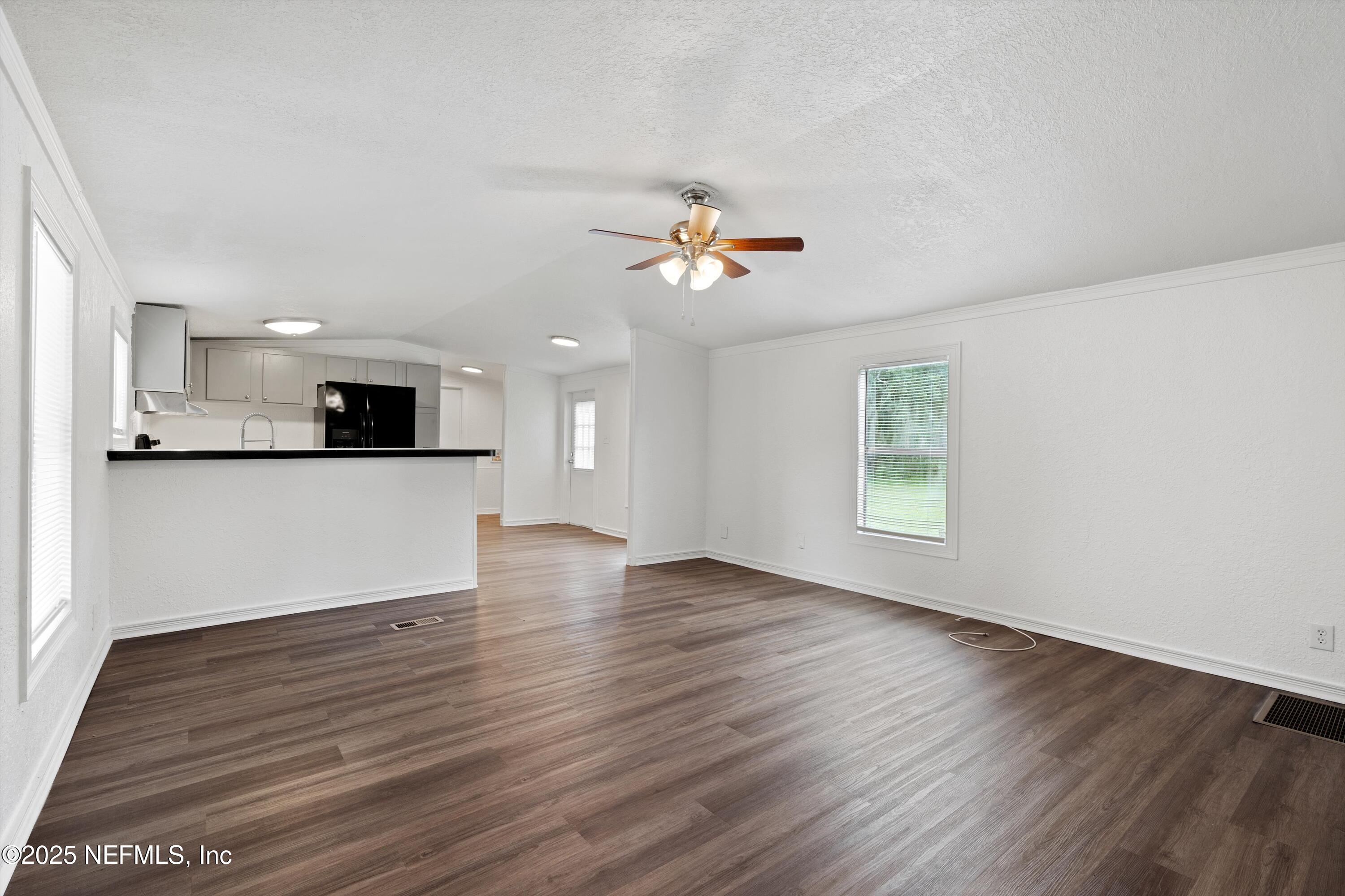 123 Mccallman Road Jacksonville, FL 32218 - Photo 3 of 62 a view of a kitchen with wooden floor and a kitchen
