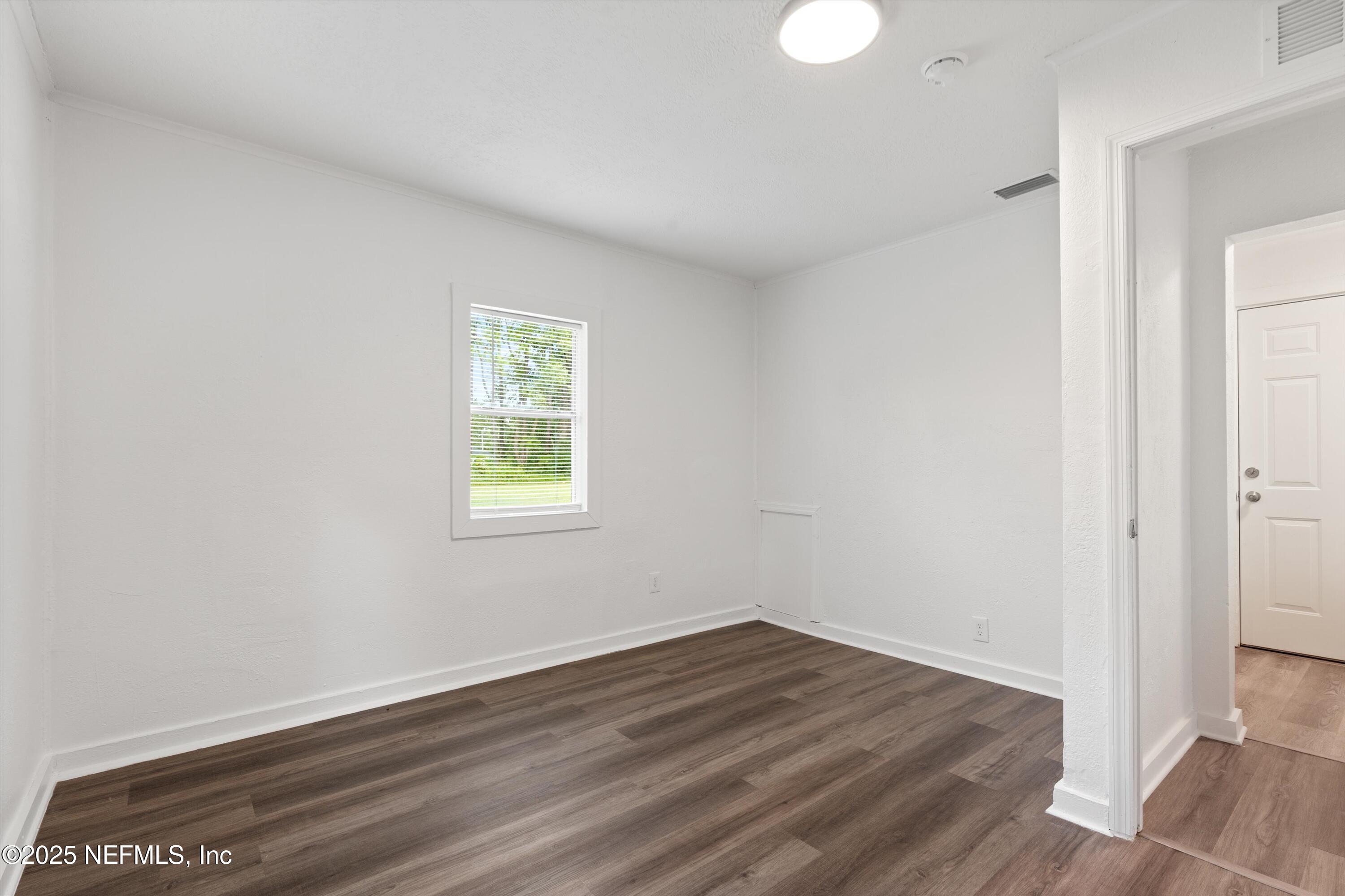 123 Mccallman Road Jacksonville, FL 32218 - Photo 33 of 62 wooden floor in an empty room