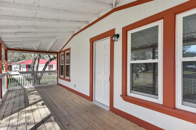 a view of a balcony with wooden floor