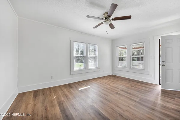 a kitchen with a sink cabinets and a window