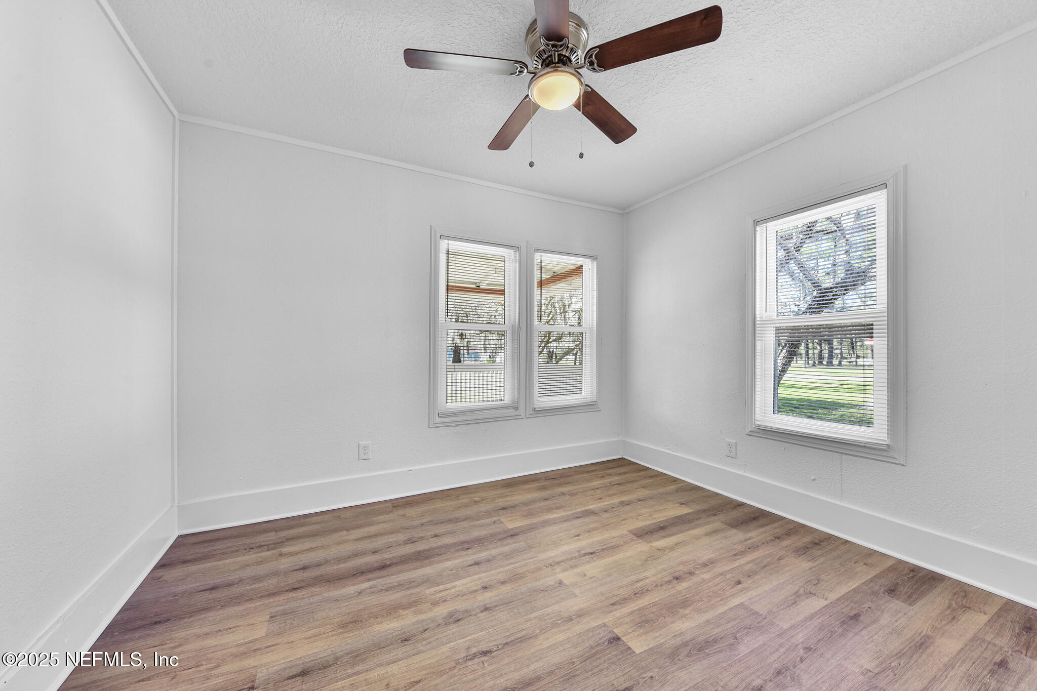 123 Mccallman Road Jacksonville, FL 32218 - Photo 43 of 62 wooden floor in an empty room with a window