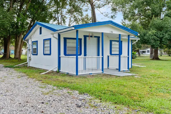 a view of a livingroom with wooden floor