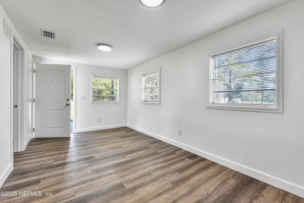 a kitchen with stainless steel appliances a stove a refrigerator and cabinets