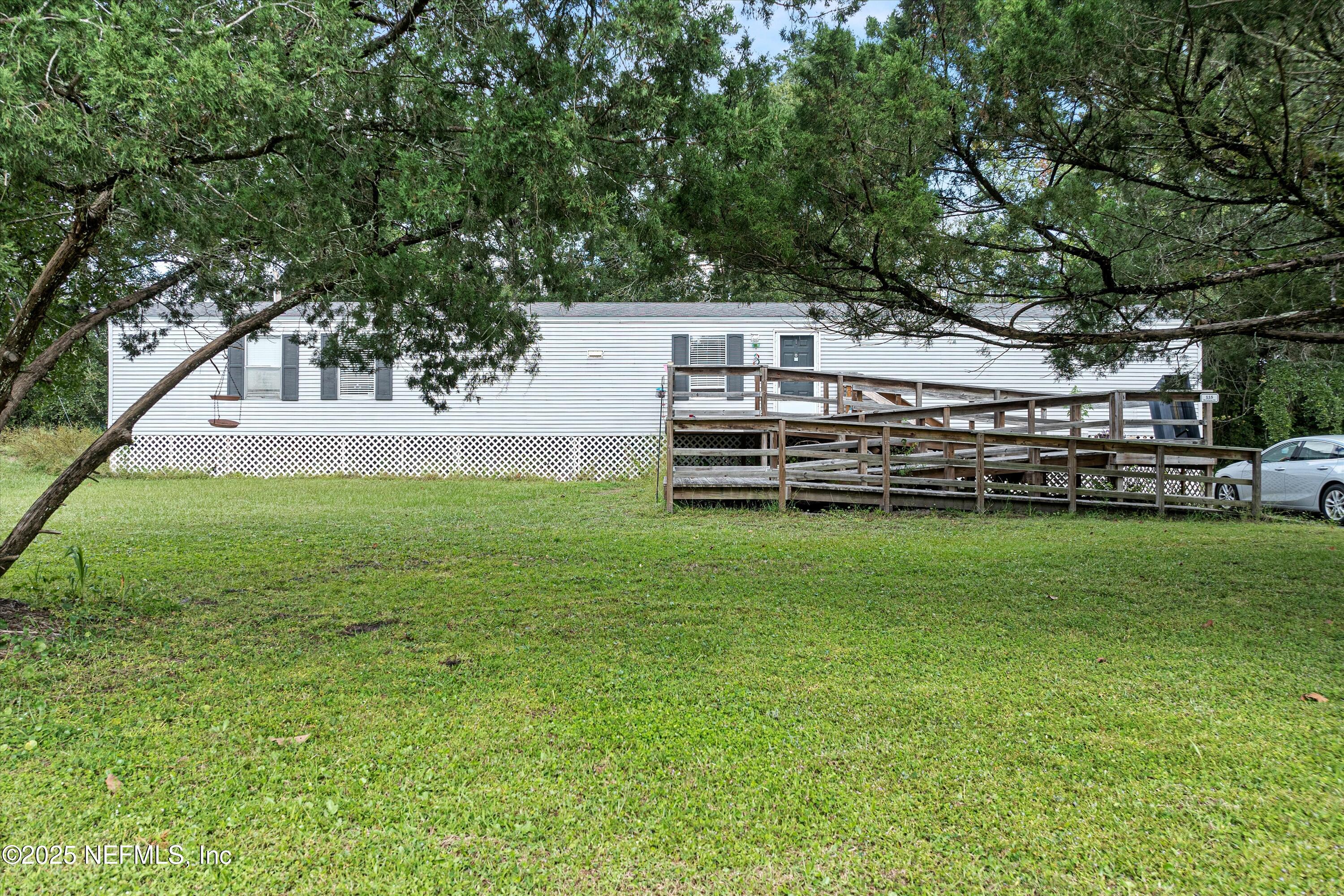 123 Mccallman Road Jacksonville, FL 32218 - Photo 54 of 62 a view of a garden with an outdoor space