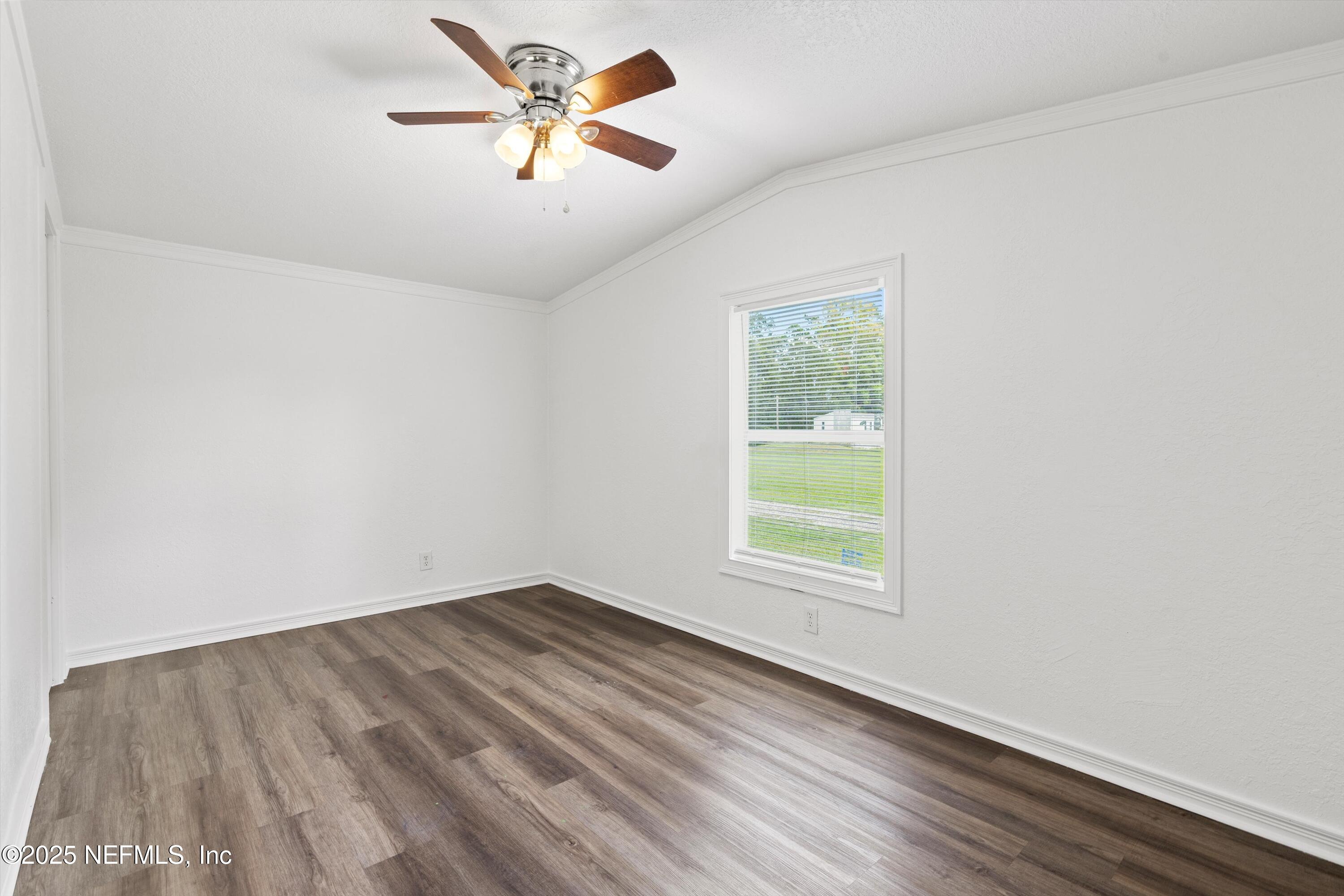 123 Mccallman Road Jacksonville, FL 32218 - Photo 8 of 62 an empty room with a window and a fan