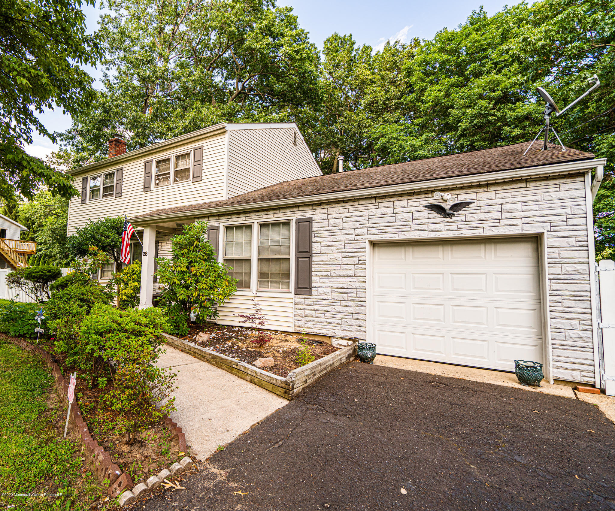 28 Holiday Road Manalapan, NJ 07726 - Photo 1 of 27 a house view with a outdoor space