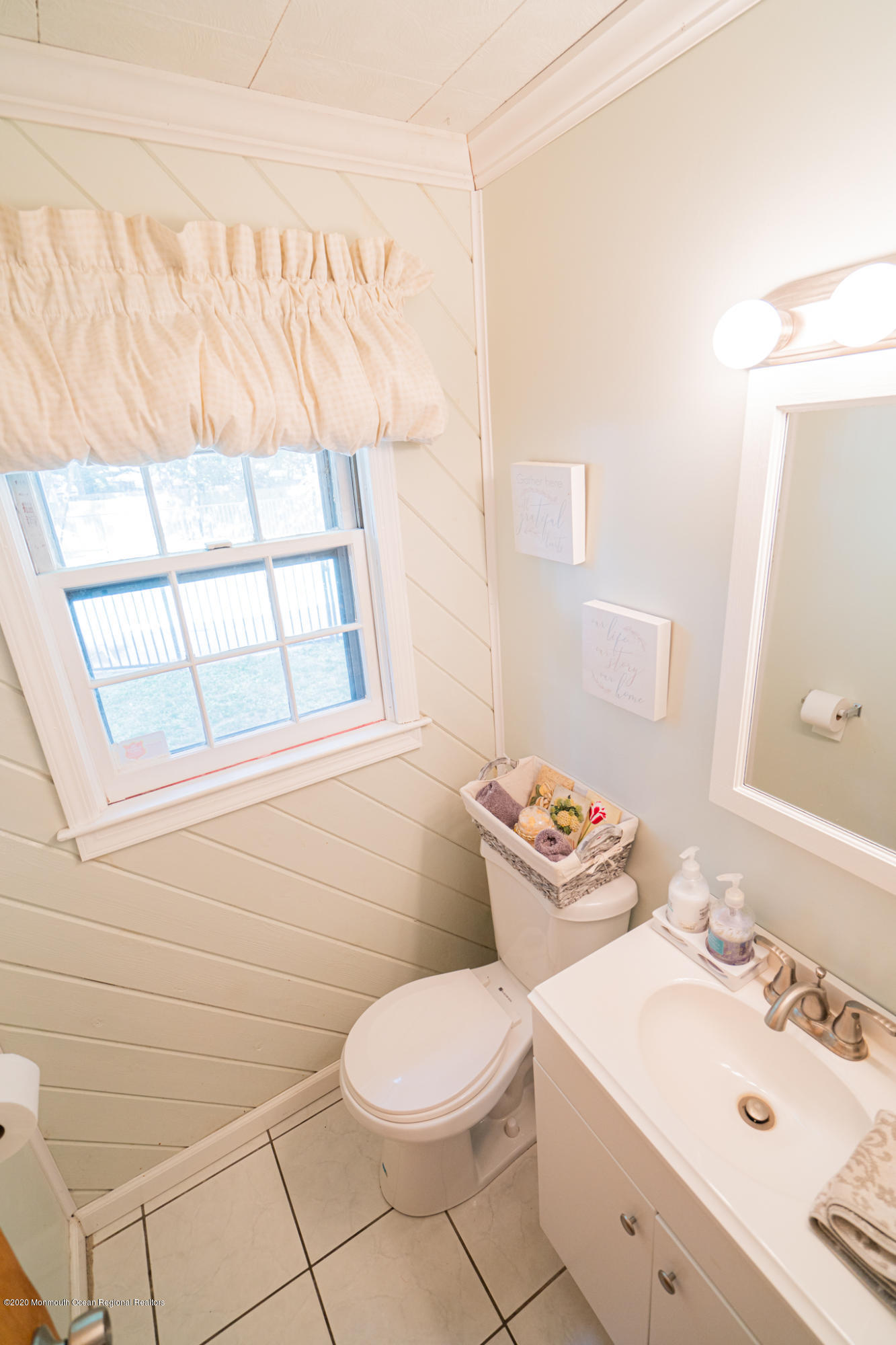 28 Holiday Road Manalapan, NJ 07726 - Photo 11 of 27 a bathroom with a sink mirror vanity and toilet