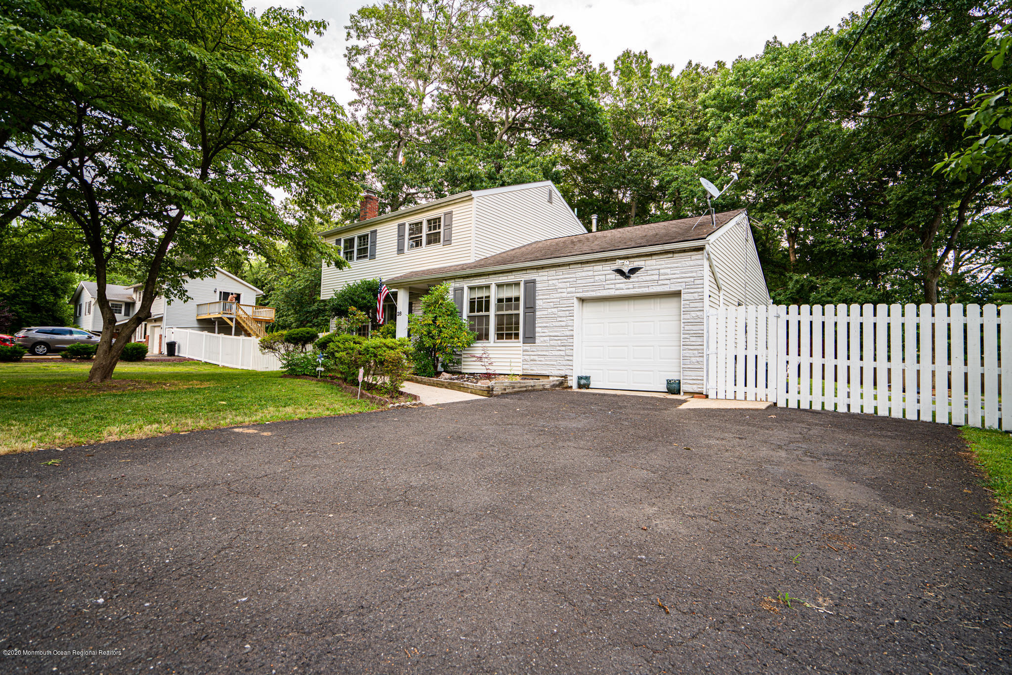 28 Holiday Road Manalapan, NJ 07726 - Photo 3 of 27 a view of a house with a yard and potted plants