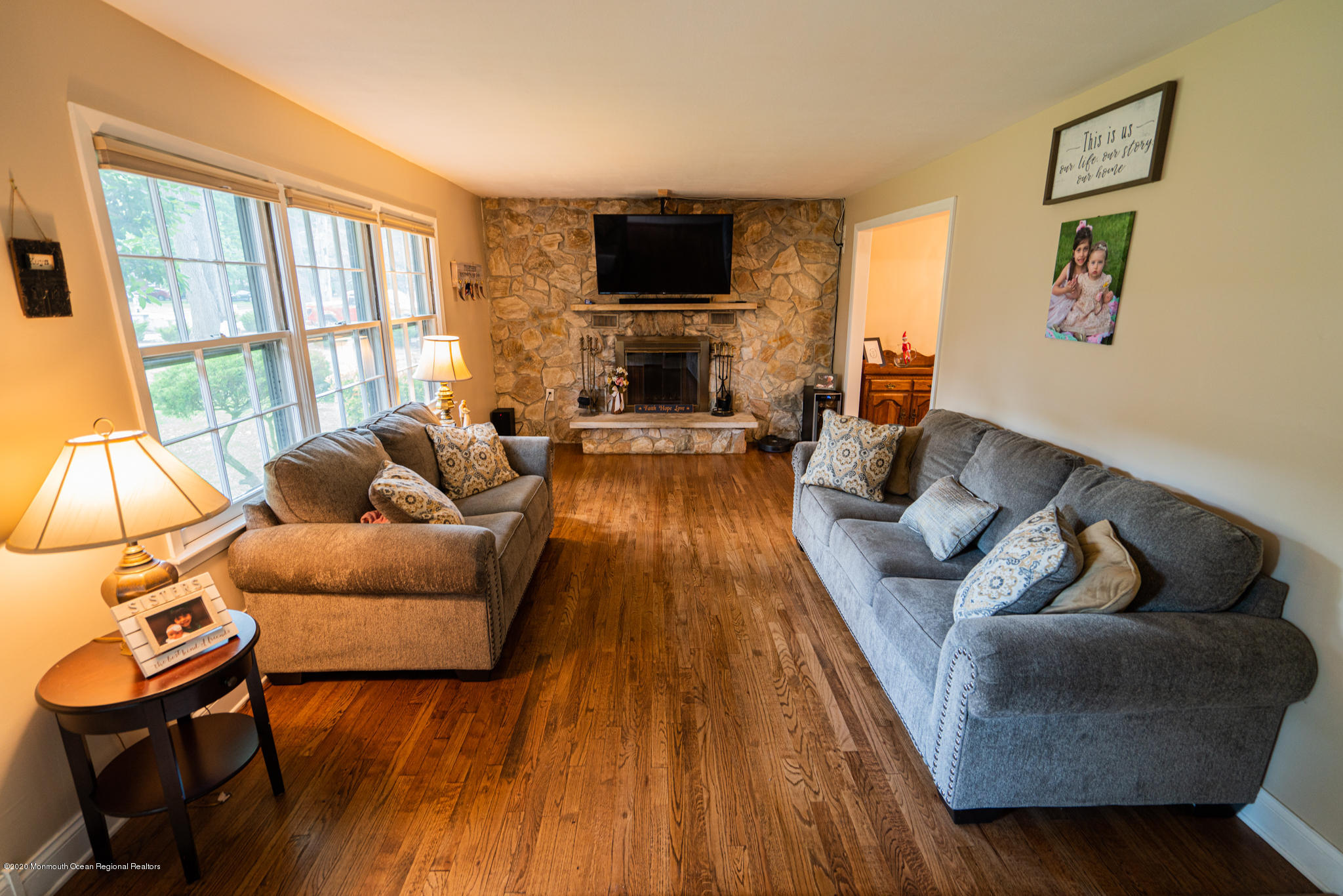 28 Holiday Road Manalapan, NJ 07726 - Photo 4 of 27 a living room with furniture and a flat screen tv