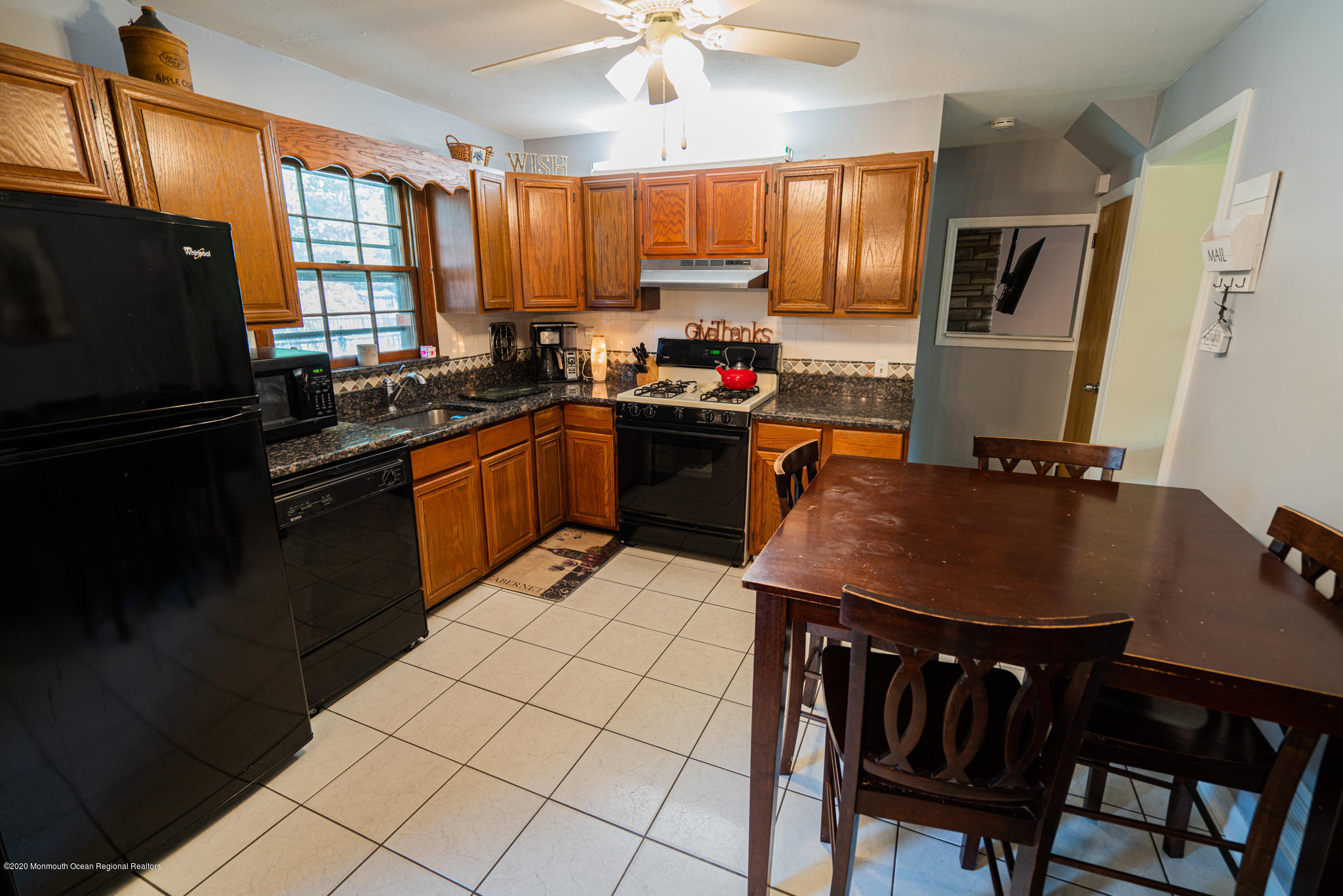 28 Holiday Road Manalapan, NJ 07726 - Photo 5 of 27 a kitchen with a refrigerator a stove a sink dishwasher and a microwave