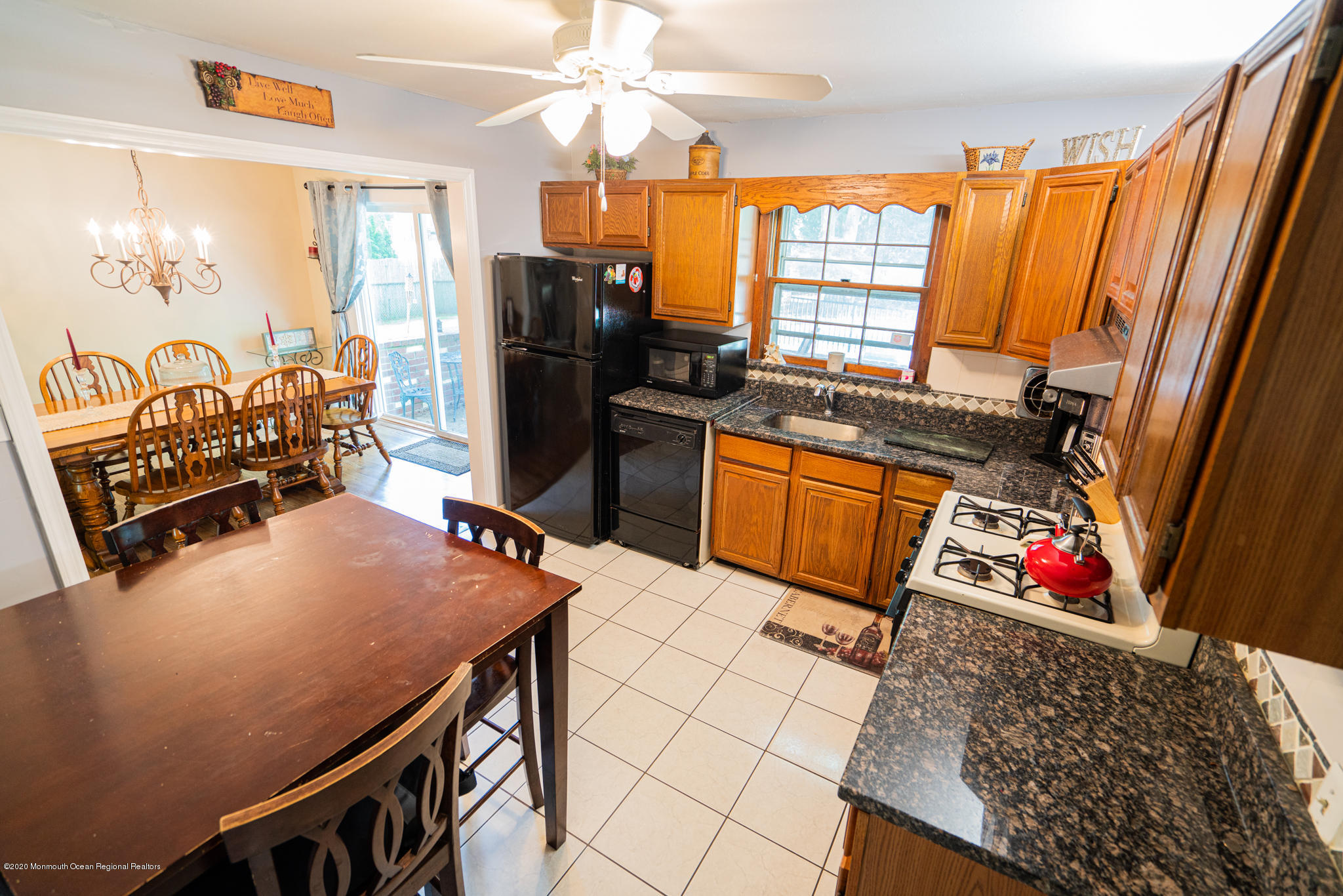 28 Holiday Road Manalapan, NJ 07726 - Photo 6 of 27 a kitchen with stainless steel appliances granite countertop sink stove top oven and cabinets