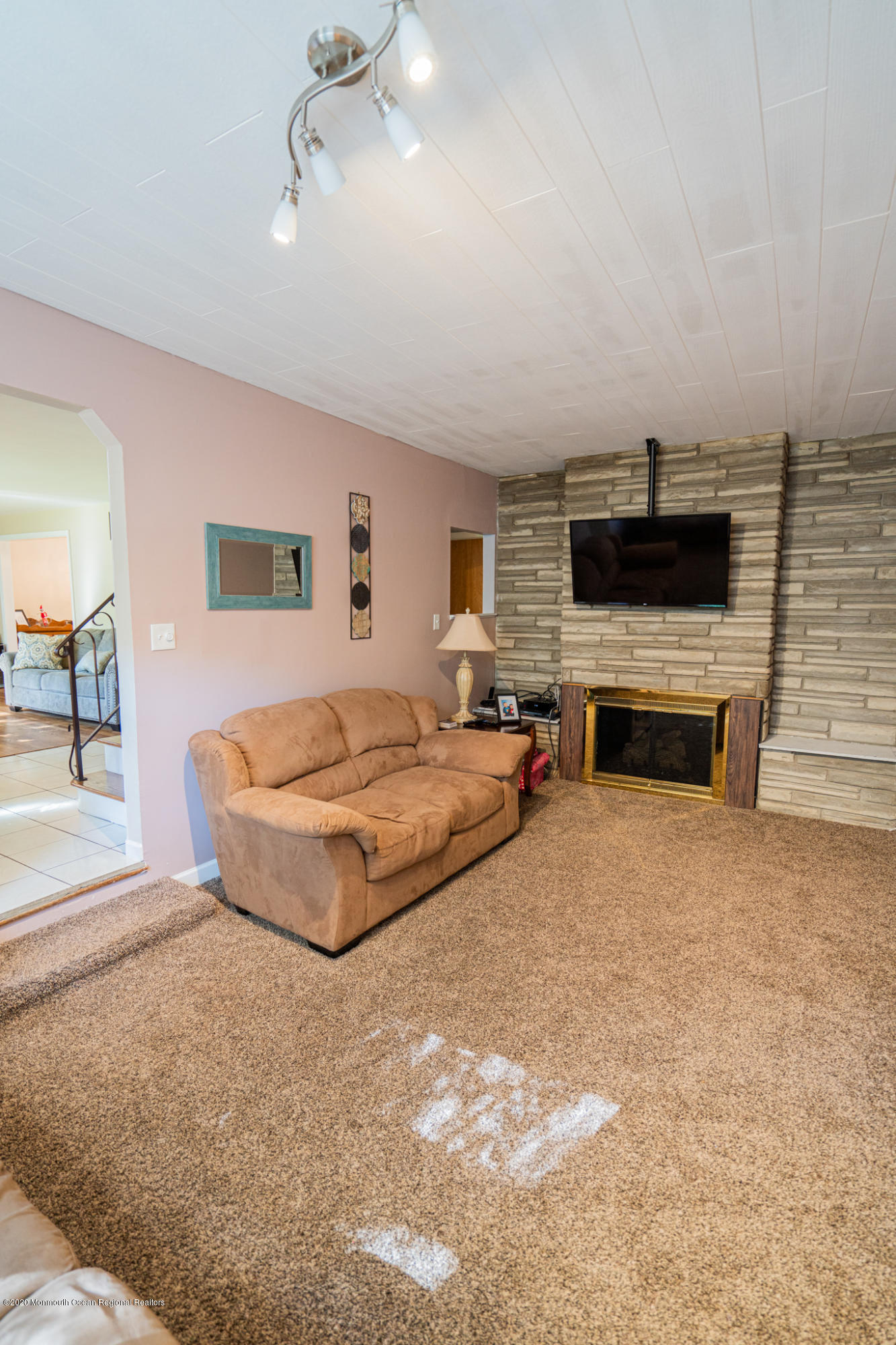 28 Holiday Road Manalapan, NJ 07726 - Photo 10 of 27 a spacious bedroom with a bed and a flat screen tv