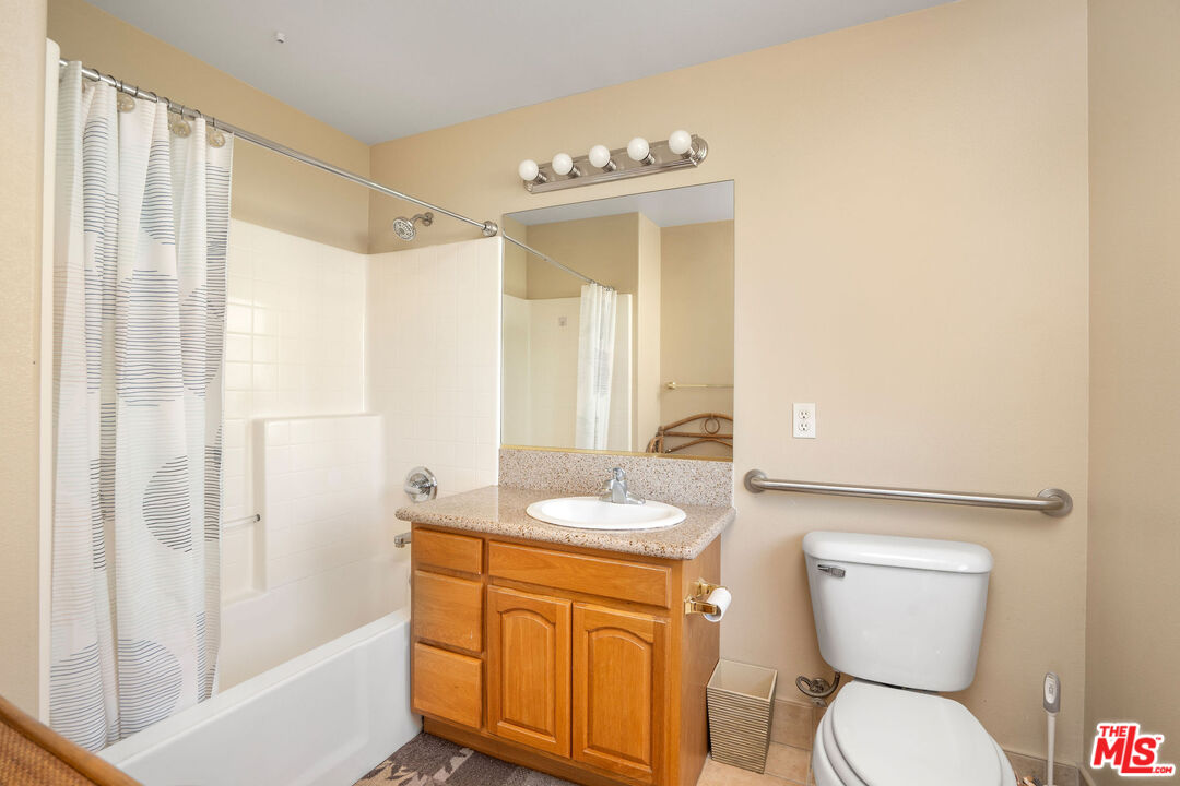 1128 West Duarte Road, Unit A Arcadia, CA 91007 - Photo 20 of 28 a bathroom with a granite countertop sink toilet and shower