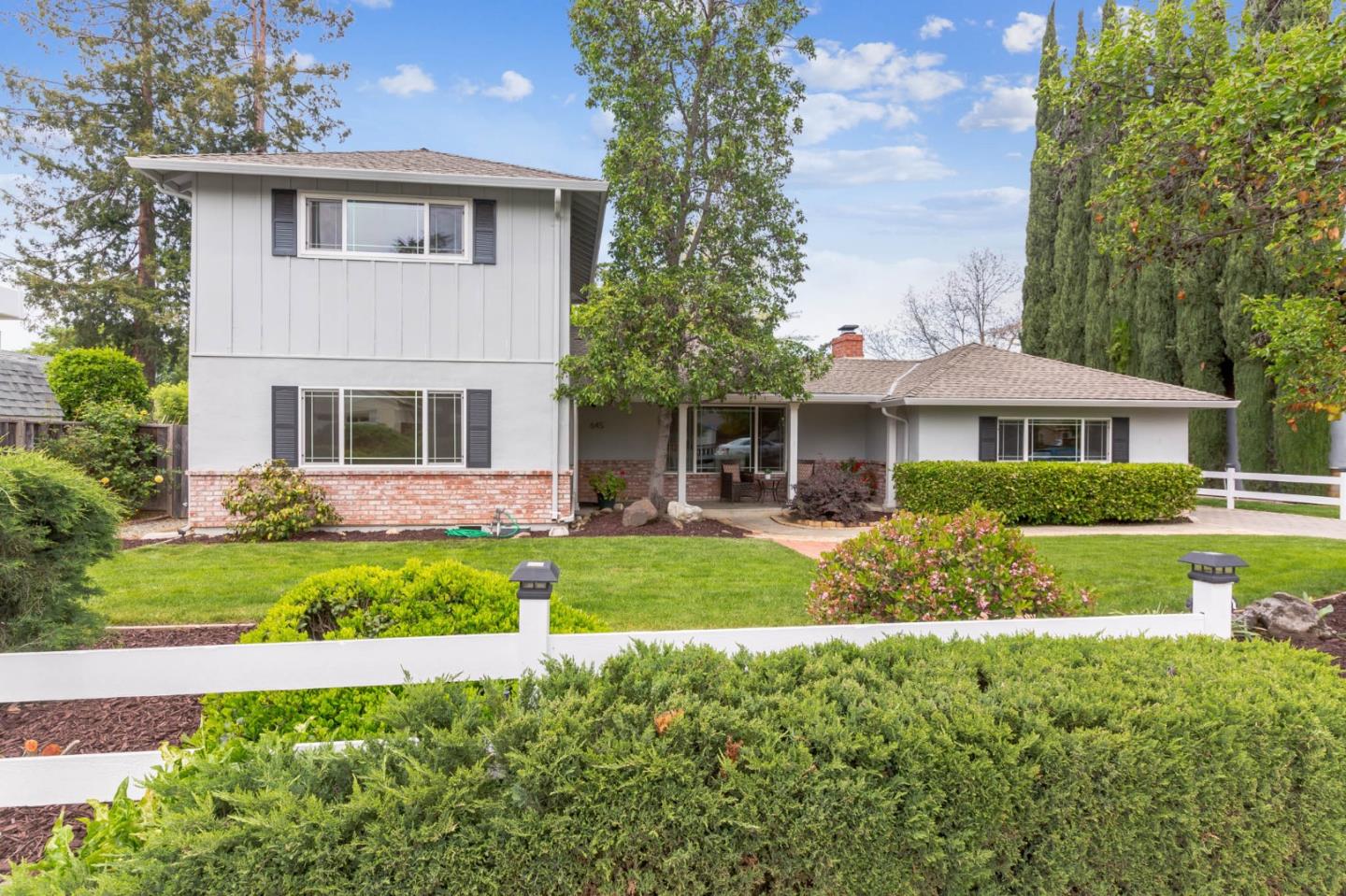645 Chapman Drive Campbell, CA 95008 - Photo 1 of 33 a front view of a house with a yard and potted plants