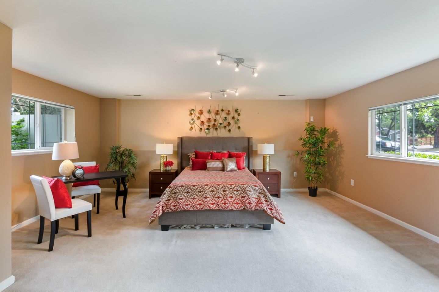 645 Chapman Drive Campbell, CA 95008 - Photo 11 of 33 a spacious bedroom with a bed and a couch