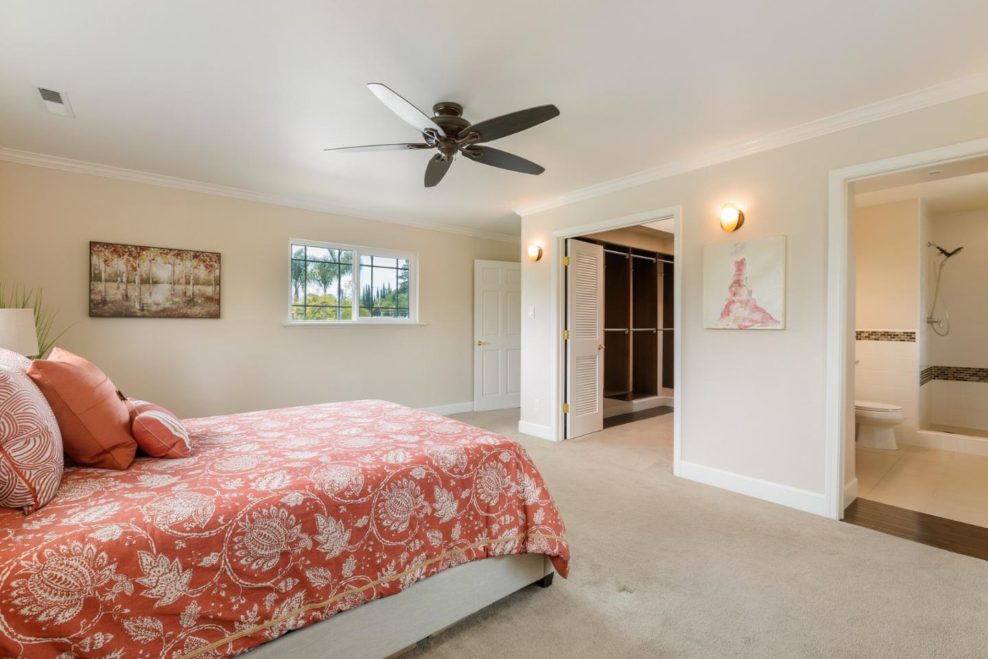 645 Chapman Drive Campbell, CA 95008 - Photo 16 of 33 a bedroom with a large bed and a chandelier