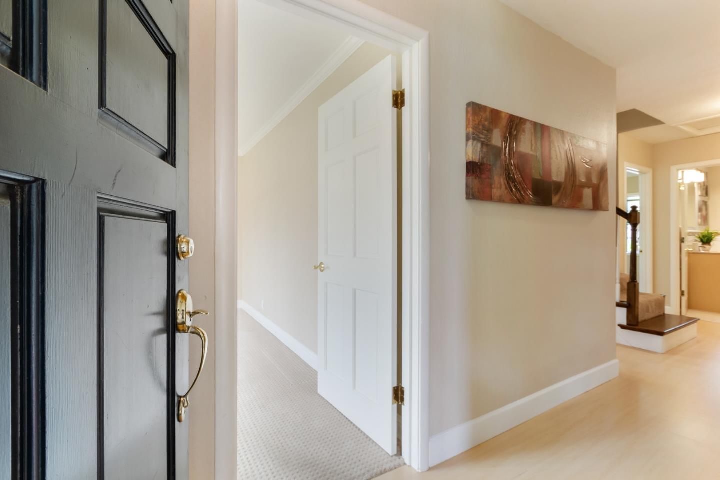 645 Chapman Drive Campbell, CA 95008 - Photo 2 of 33 a view of a hallway with wooden floor and staircase