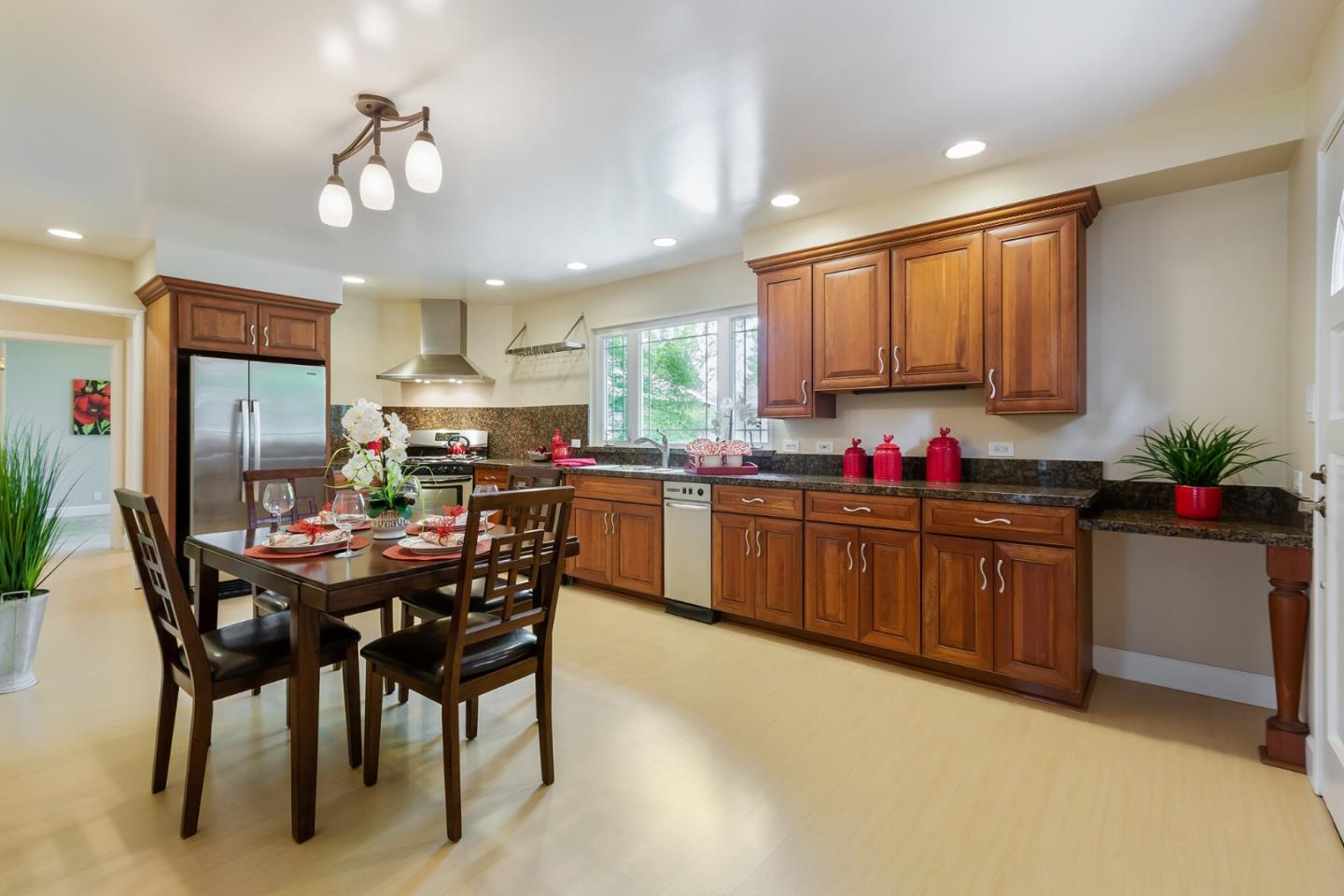 645 Chapman Drive Campbell, CA 95008 - Photo 5 of 33 a kitchen with granite countertop a sink cabinets and window