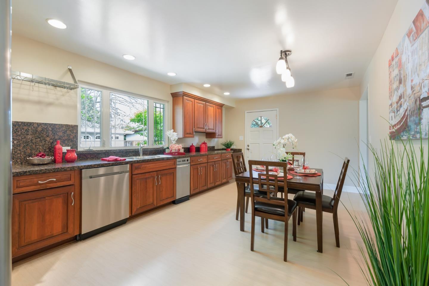 645 Chapman Drive Campbell, CA 95008 - Photo 7 of 33 a kitchen with granite countertop sink table and chairs