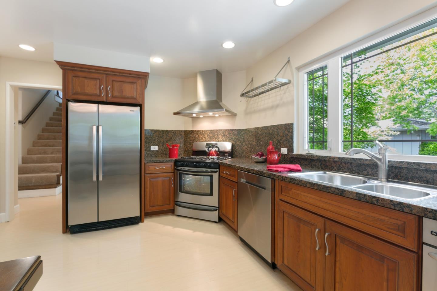 645 Chapman Drive Campbell, CA 95008 - Photo 8 of 33 a kitchen with stainless steel appliances granite countertop a sink and a refrigerator