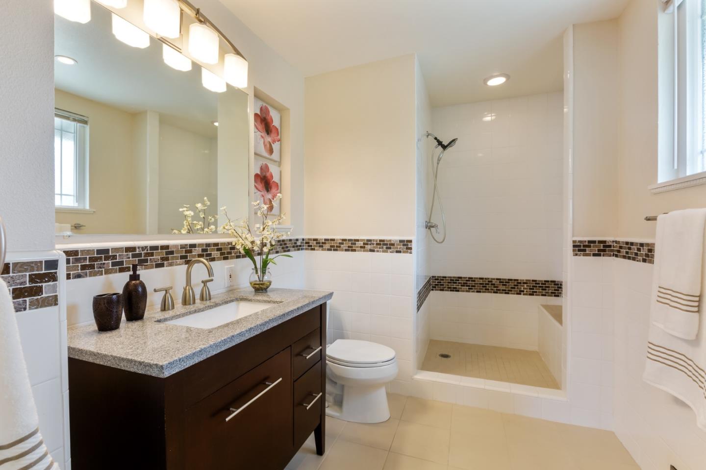 645 Chapman Drive Campbell, CA 95008 - Photo 9 of 33 a bathroom with a sink and a mirror