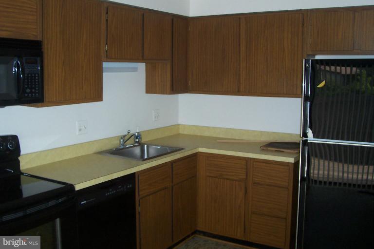 11614 Newbridge Court Reston, VA 20191 - Photo 1 of 16 a bathroom with a sink and a mirror